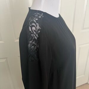 Ladies black dress with lace inserts detail